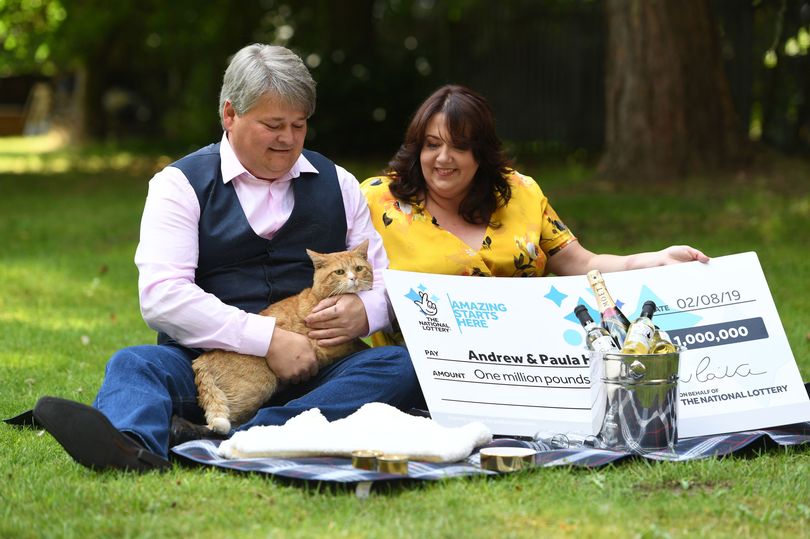 scratch card winners and their cat